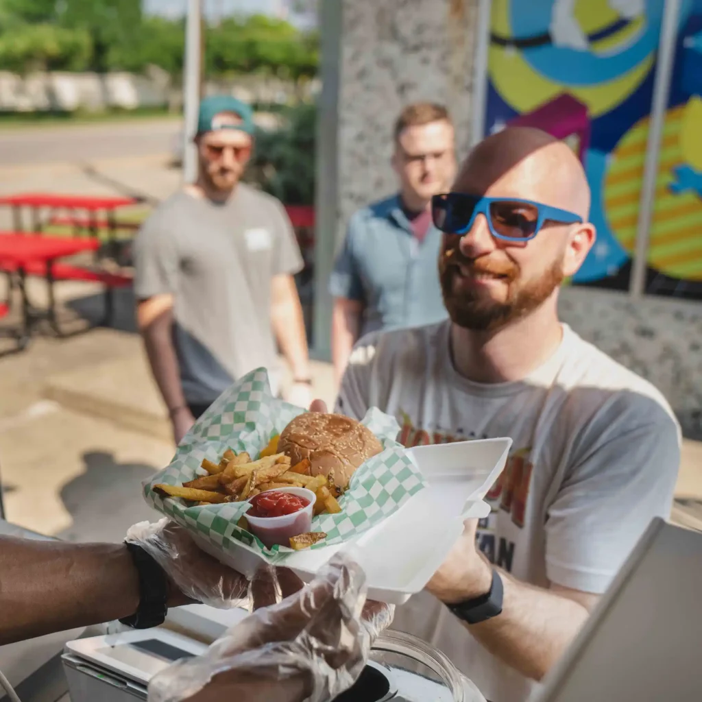 Customer receiving food from a food truck