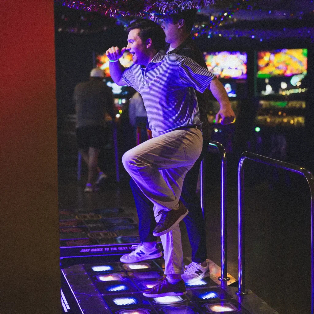 corporate business man playing a dancing game